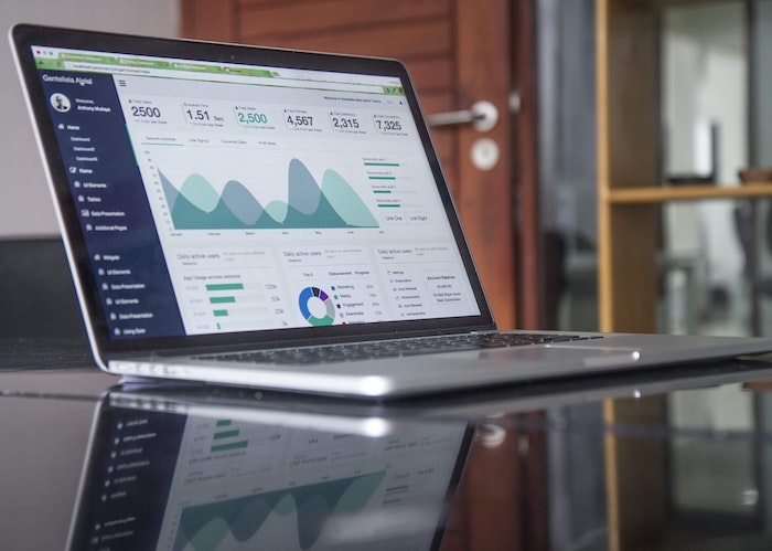 graphs on laptop screen showing website traffic